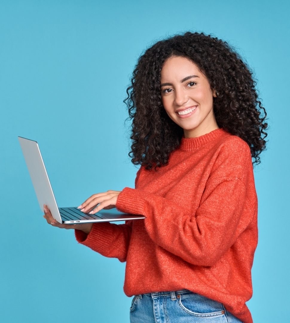 Smiling woman working on a laptop